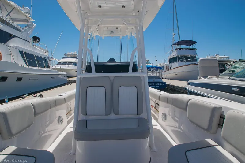 Slide: The Image of 2021 Sea Fox 248 Commander boat interior at marina, surrounded by yachts. - 19