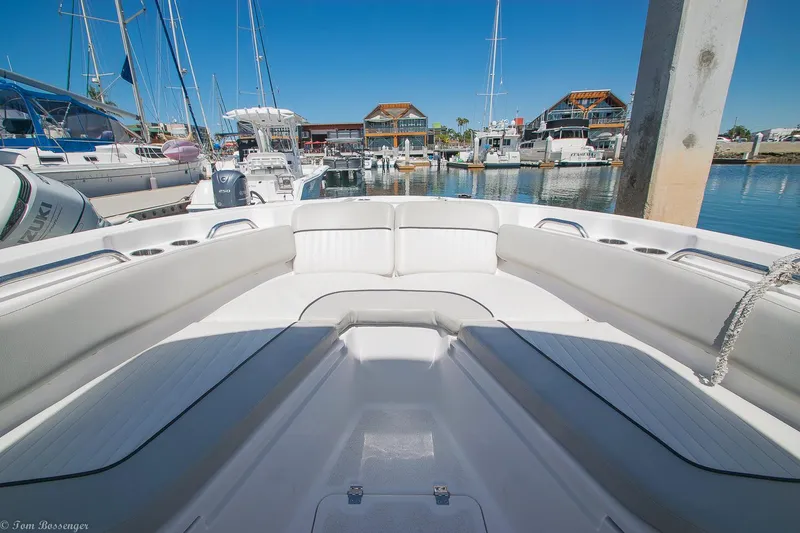 Slide: The Image of 2021 Sea Fox 248 Commander boat interior at marina, showcasing spacious seating and sleek design. - 20