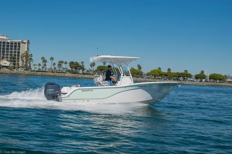 Slide: The Image of 2021 Sea Fox 248 Commander boat cruising on a sunny day near the shoreline. - 34