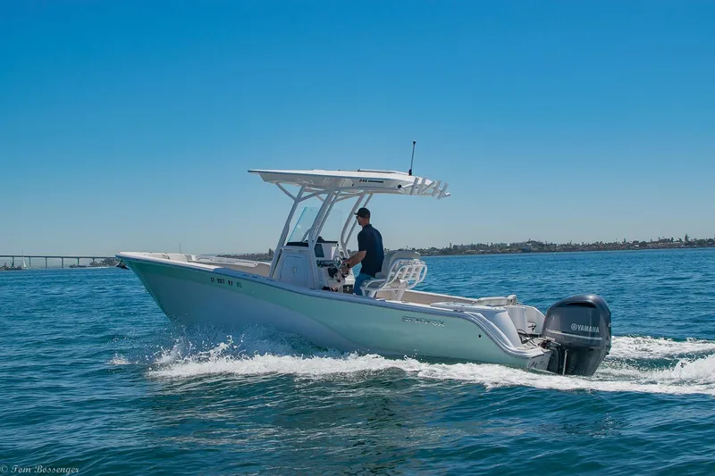 Slide: The Image of 2021 Sea Fox 248 Commander boat cruising on open water under clear blue sky. - 43