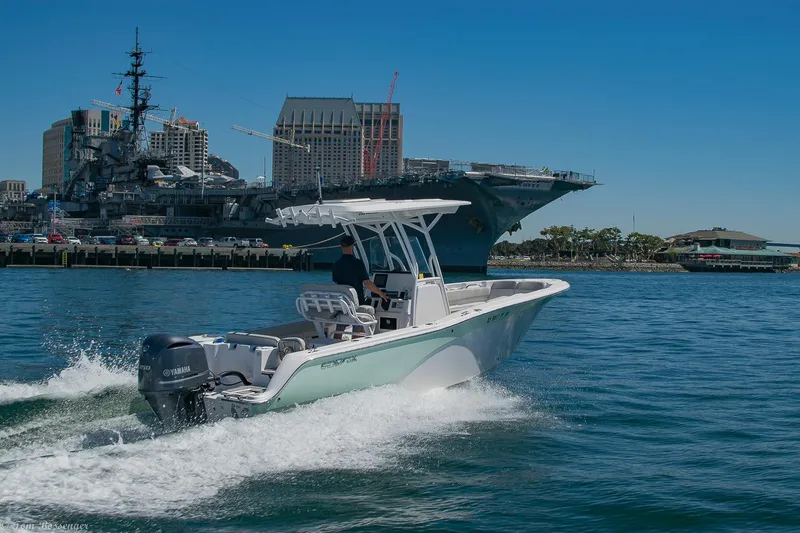 Slide: The Image of 2021 Sea Fox 248 Commander boat cruising near a large ship in a harbor. - 47