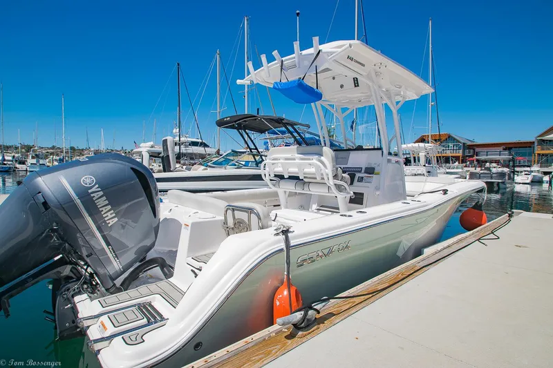 Slide: The Image of 2021 Sea Fox 248 Commander boat docked with Yamaha engine, in a marina setting. - 5