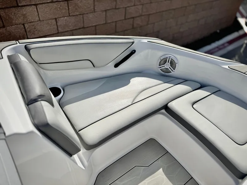Slide: The Image of 2022 Yamaha Boats AR 190 interior seating with speaker and cup holder. - 12