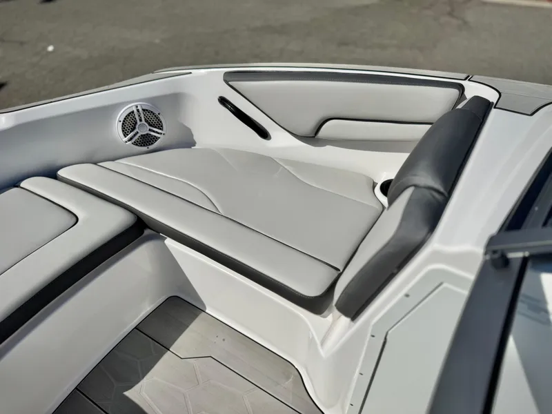 Slide: The Image of 2022 Yamaha Boats AR 190 interior with sleek gray seating and speaker. - 13