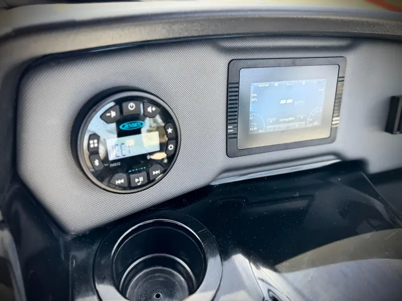 Slide: The Image of Dashboard of 2022 Yamaha Boats AR 190 with digital display and controls. - 25