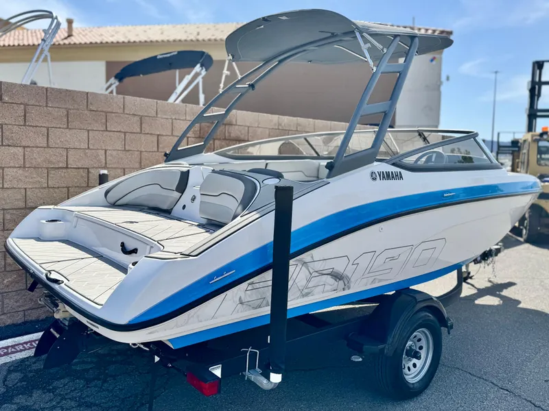 Slide: The Image of 2022 Yamaha AR 190 boat on trailer, featuring sleek design and blue accents. - 5