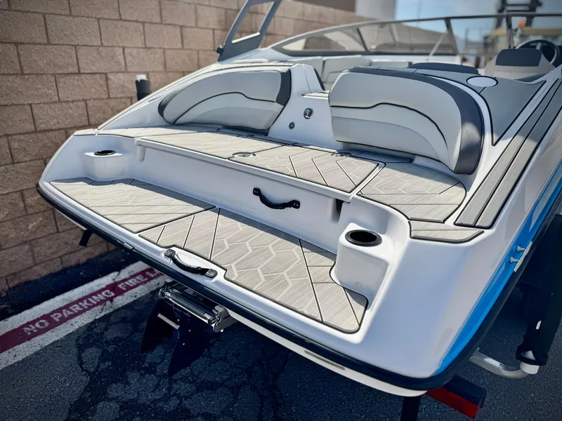 Slide: The Image of 2022 Yamaha Boats AR 190, rear view, showcasing sleek design and comfortable seating. - 6