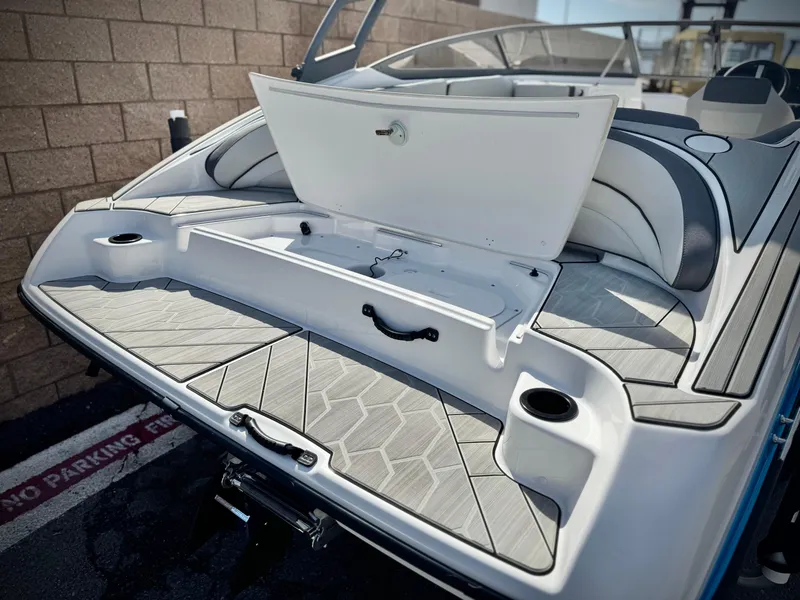 Slide: The Image of 2022 Yamaha Boats AR 190 rear view, showcasing open storage and seating area. - 7