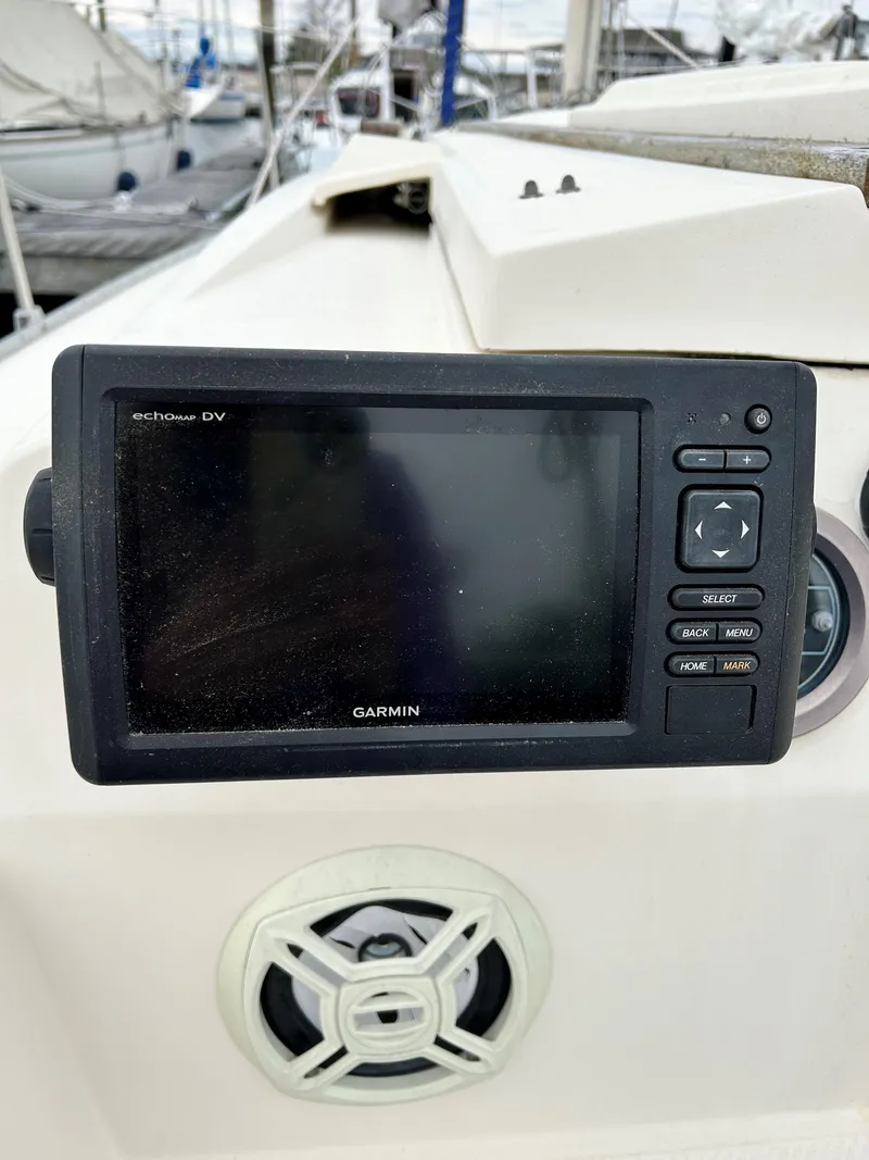 Slide: The Image of Garmin marine GPS device on 1984 Hunter 25.5 sailboat dashboard. - 6