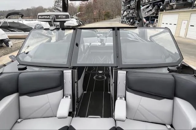 Slide: The Image of 2025 Supra SL boat interior with sleek seating and modern design. - 10