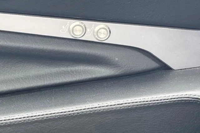 Slide: The Image of 2025 Supra SL interior door panel with seat adjustment buttons. - 11