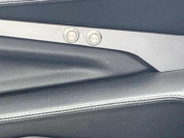 Slide: The Image of 2024 Supra SL interior door panel with seat adjustment controls. - 19