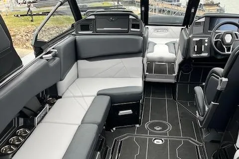 Slide: The Image of 2025 Supra SL boat interior with modern seating and sleek dashboard design. - 4