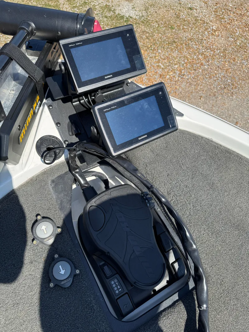 Slide: The Image of 2016 Skeeter ZX 225 boat dashboard with dual fish finders and foot pedal. - 14