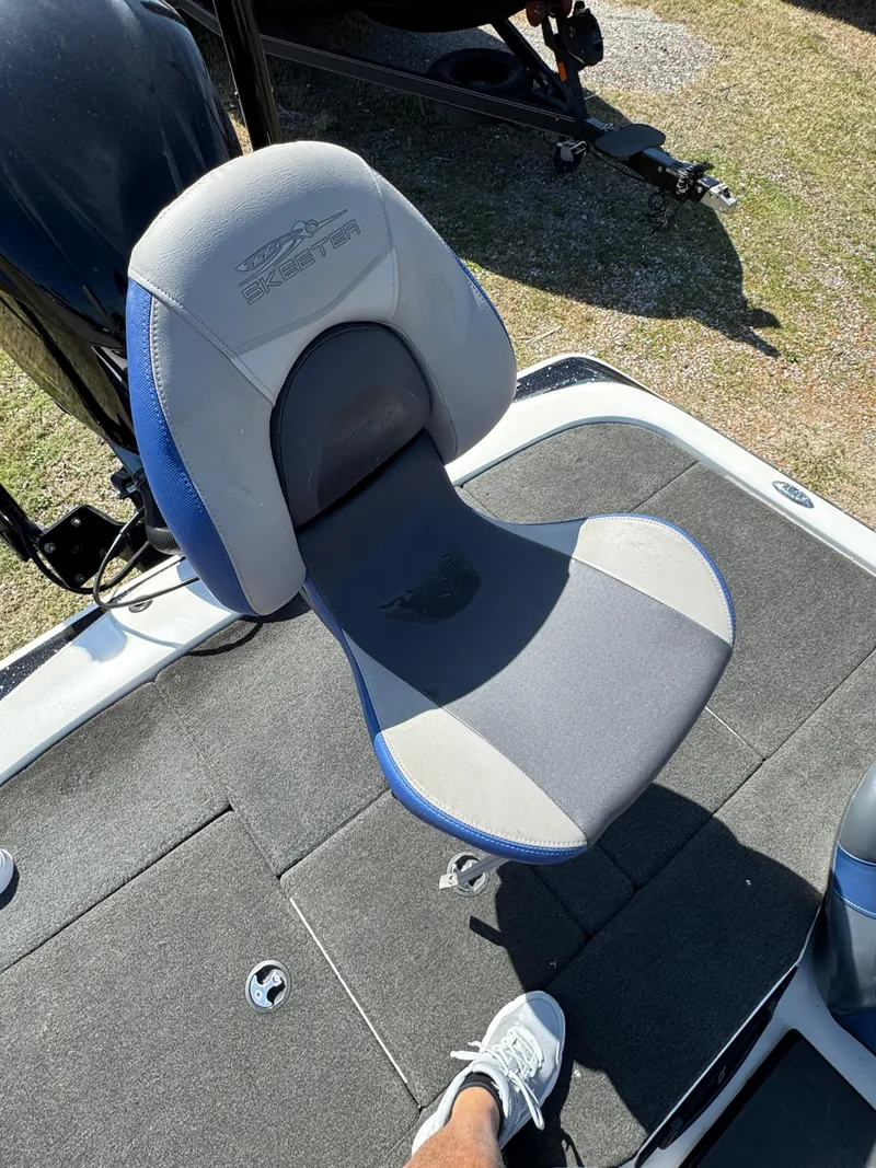 Slide: The Image of 2016 Skeeter ZX 225 boat seat with gray and blue upholstery. - 18