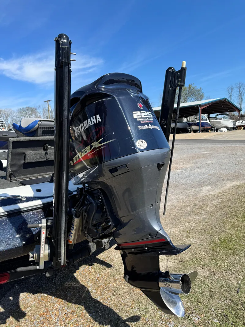 Slide: The Image of 2016 Skeeter ZX 225 boat with Yamaha outboard motor, parked outdoors. - 5