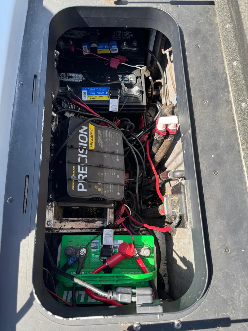 Slide: The Image of 2016 Skeeter ZX 225 boat battery compartment with Precision charger and wiring. - 7