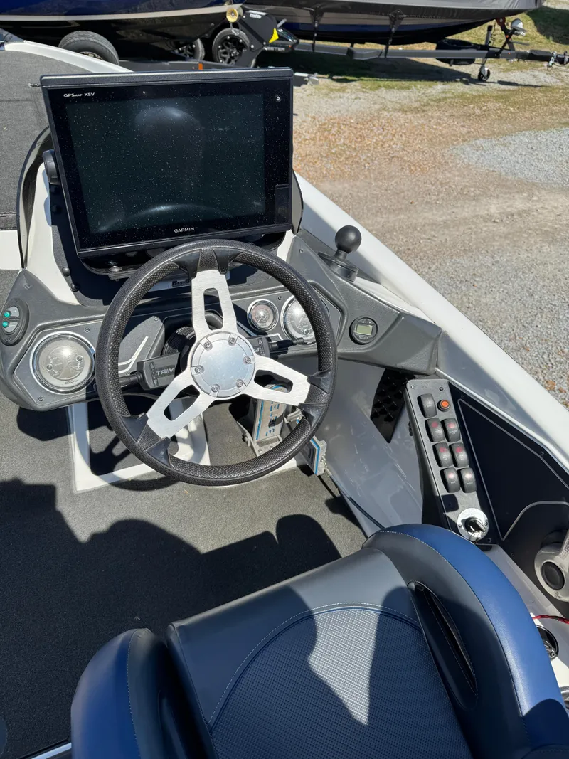 Slide: The Image of 2016 Skeeter ZX 225 boat cockpit with steering wheel and control panel. - 8