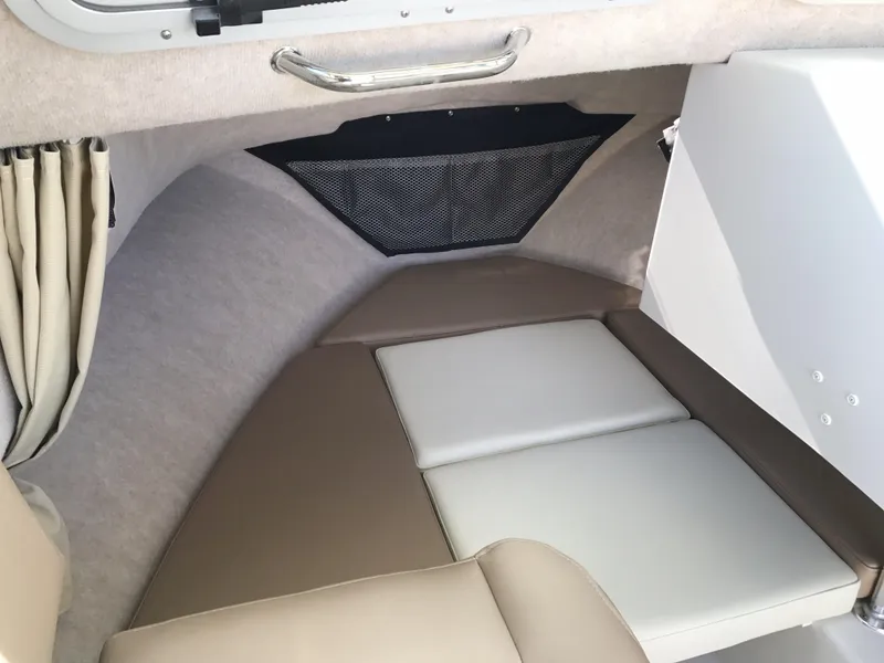 Slide: The Image of 2019 Parker 2320 SL Sport Cabin interior with cushioned seating and storage net. - 16