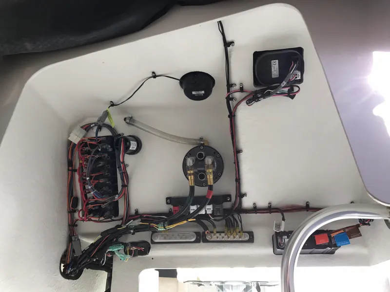Slide: The Image of Electrical wiring inside a 2019 Parker 2320 SL Sport Cabin boat. - 17