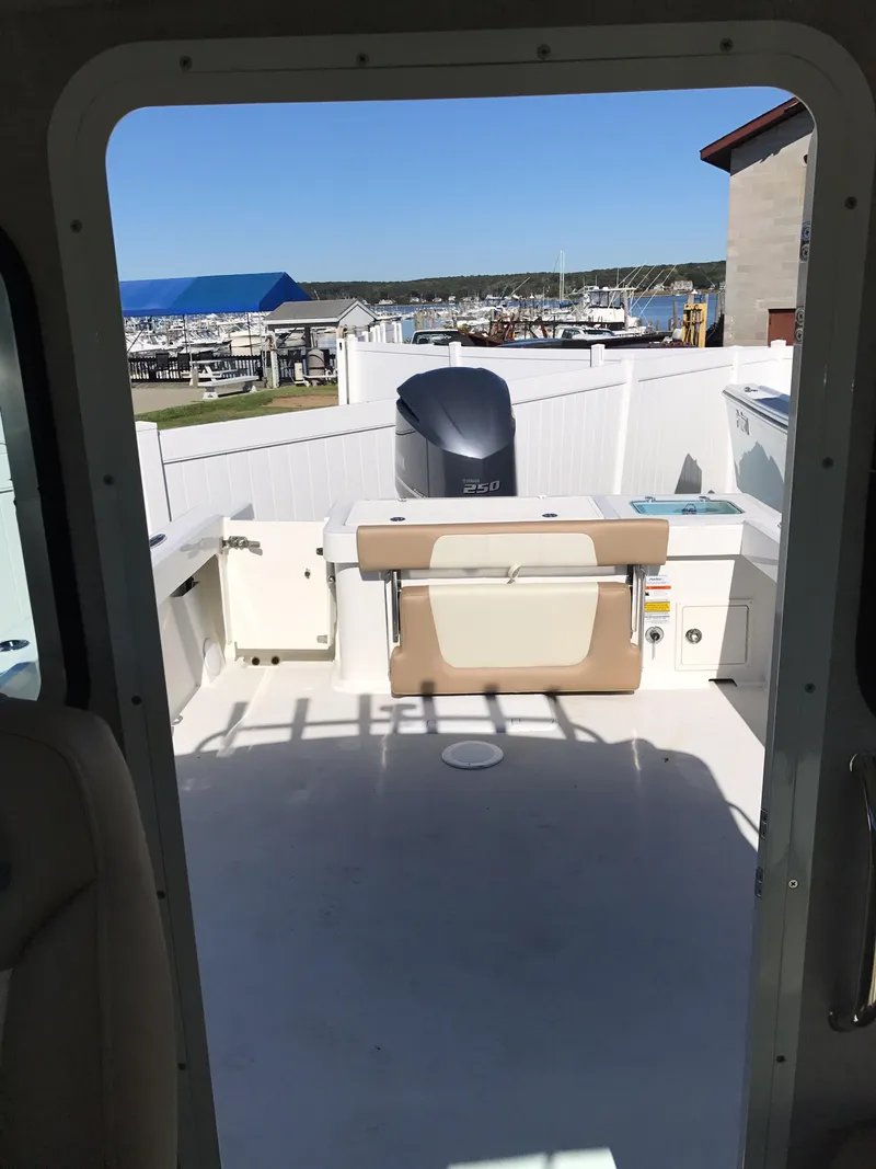 Slide: The Image of 2019 Parker 2320 SL Sport Cabin boat interior with outdoor view. - 18