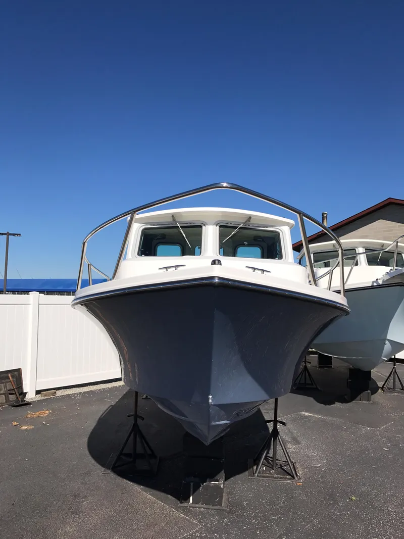 Slide: The Image of 2019 Parker 2320 SL Sport Cabin boat on display, front view. - 2