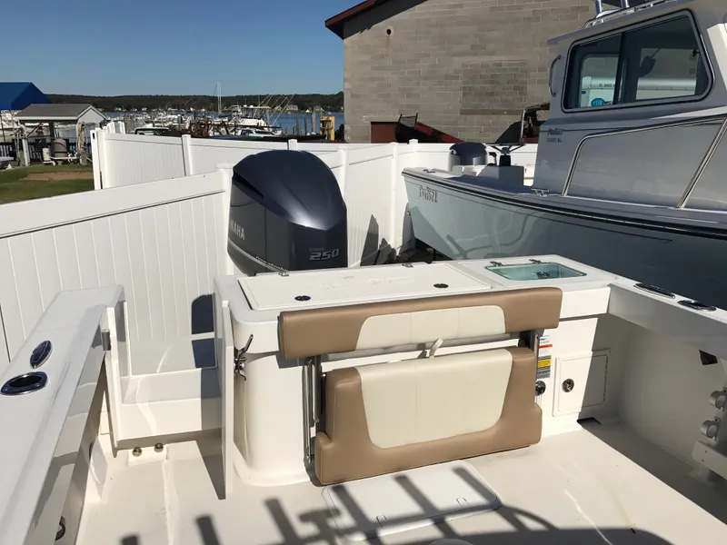 Slide: The Image of 2019 Parker 2320 SL Sport Cabin boat with Yamaha 250 engine, docked near marina. - 7