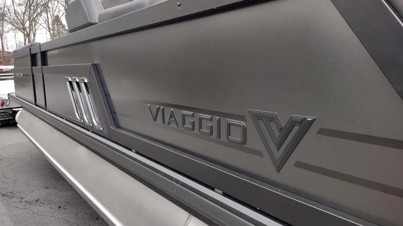 Slide: The Image of 2025 Viaggio Diamante boat side view with sleek design and logo detailing. - 10