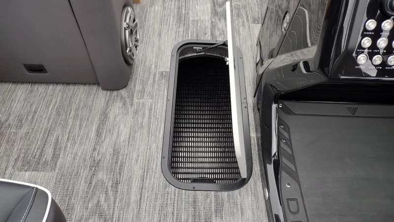 Slide: The Image of 2025 Viaggio Diamante boat interior with open storage compartment on carpeted floor. - 26