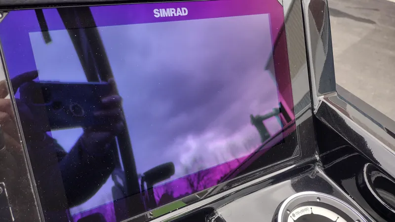 Slide: The Image of Simrad display on Viaggio Diamante 2025 boat, reflecting cloudy sky. - 29