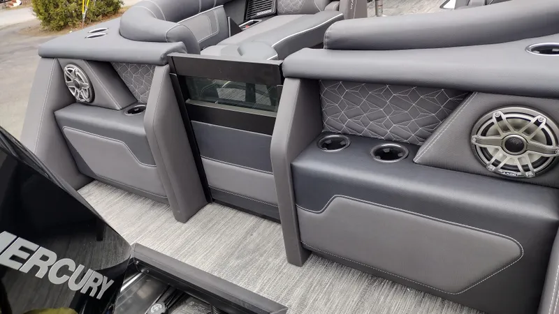 Slide: The Image of 2025 Viaggio Diamante boat interior with gray seating, cup holders, and speakers. - 38