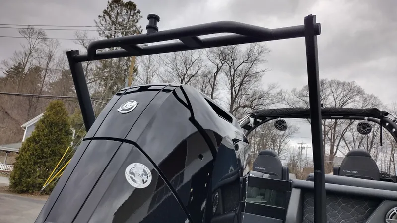 Slide: The Image of 2025 Viaggio Diamante boat with sleek black design and modern features, under cloudy sky. - 39