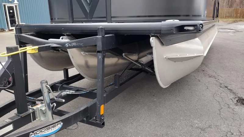 Slide: The Image of 2025 Viaggio Diamante pontoon boat on trailer, showcasing sturdy aluminum pontoons. - 41