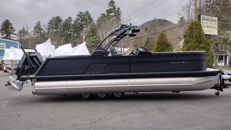 Slide: The Image of 2025 Viaggio Diamante pontoon boat parked outdoors, showcasing sleek black design and modern features. - 5