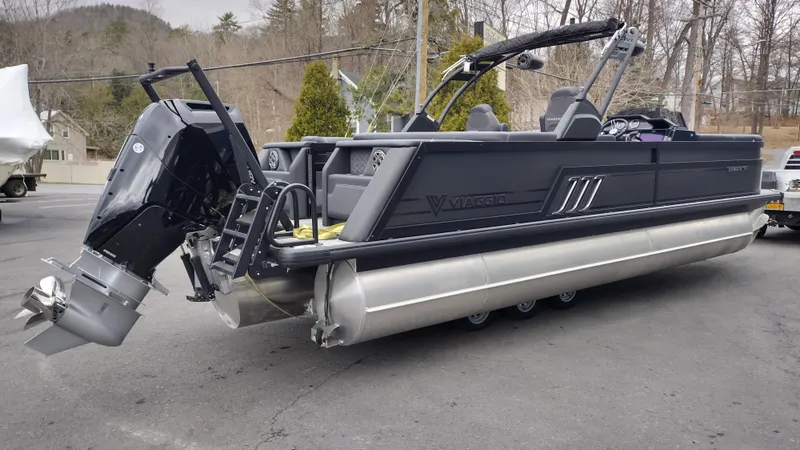 Slide: The Image of 2025 Viaggio Diamante pontoon boat with sleek design and powerful outboard motor. - 6