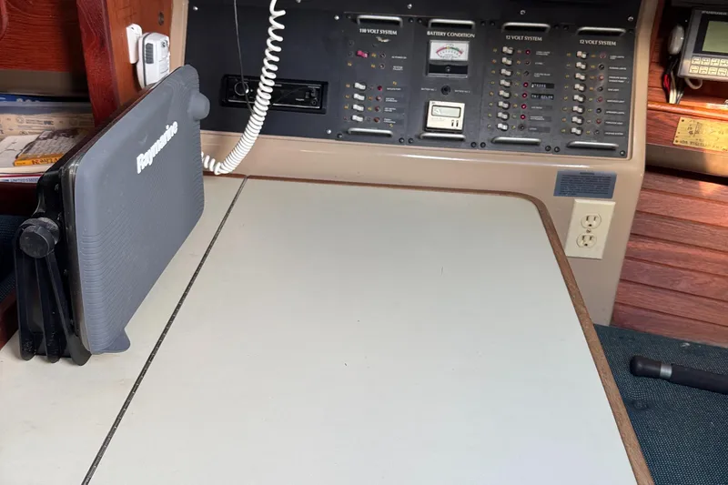 Slide: The Image of Navigation station on a 1984 C&C 35 MK III sailboat with control panels and equipment. - 20