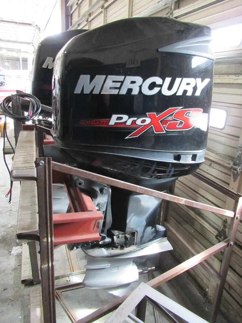Slide: The Image of 2018 Mercury 250L PRO XS outboard motor in a workshop setting. - 1
