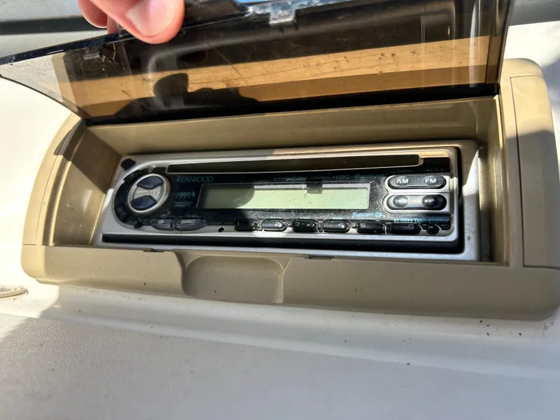 Slide: The Image of Kenwood stereo system in a 2005 Stingray 195 FX boat dashboard. - 13