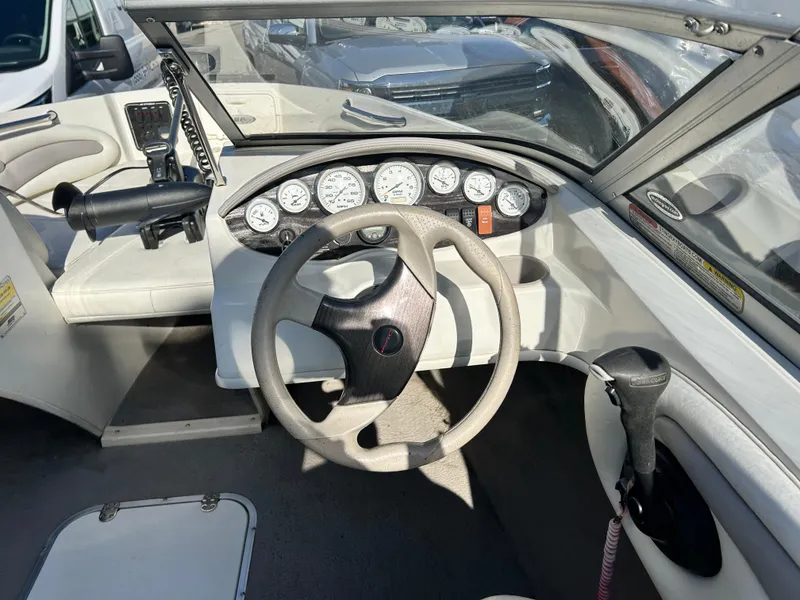 Slide: The Image of 2005 Stingray 195 FX boat dashboard with steering wheel and instrument panel. - 5