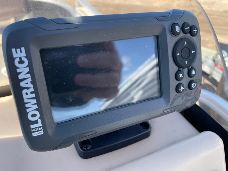 Slide: The Image of Lowrance Hook fish finder on 2017 Sun Tracker BB18 boat dashboard. - 14
