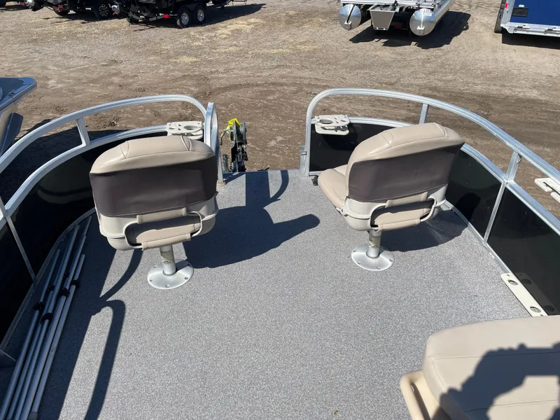 Slide: The Image of 2017 Sun Tracker BB18 boat deck with two swivel seats and railing. - 8