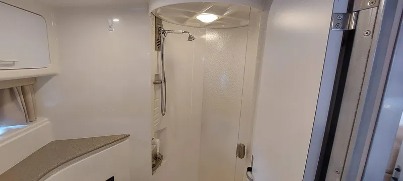 Slide: The Image of 1998 Formula 41 PC yacht bathroom with shower and modern fixtures. - 10
