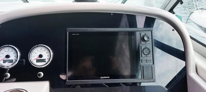 Slide: The Image of Dashboard of a 1998 Formula 41 PC boat with Garmin navigation system. - 12