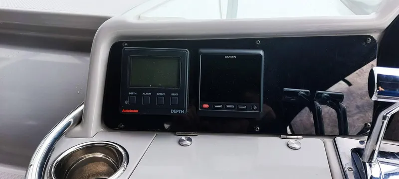 Slide: The Image of Control panel of a 1998 Formula 41 PC boat with navigation instruments. - 13