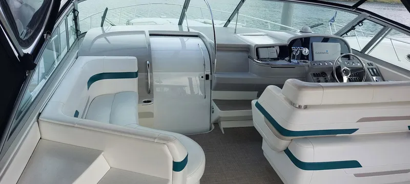 Slide: The Image of 1998 Formula 41 PC yacht interior with white seating and modern dashboard. - 14