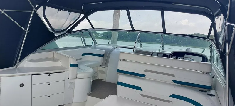Slide: The Image of 1998 Formula 41 PC boat interior with seating and helm, featuring sleek design and spacious layout. - 15