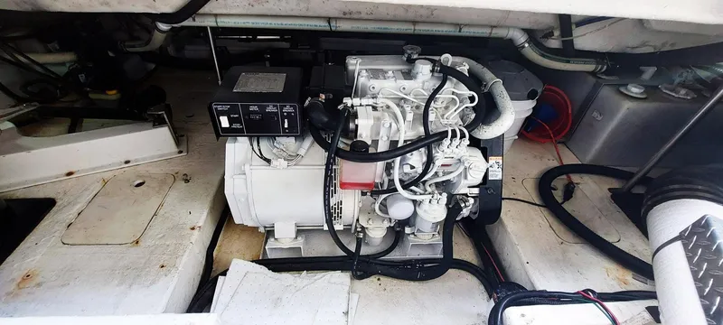 Slide: The Image of Engine compartment of a 1998 Formula 41 PC boat, showcasing mechanical components. - 26