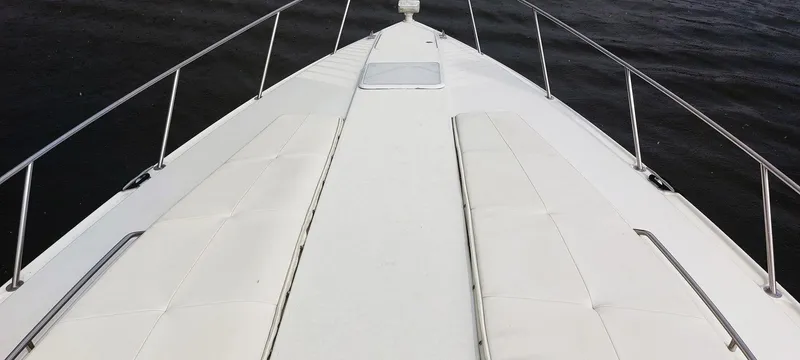 Slide: The Image of Bow view of a 1998 Formula 41 PC yacht on water. - 29