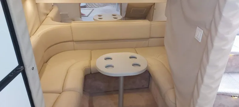 Slide: The Image of 1998 Formula 41 PC interior with beige leather seating and a small table. - 3