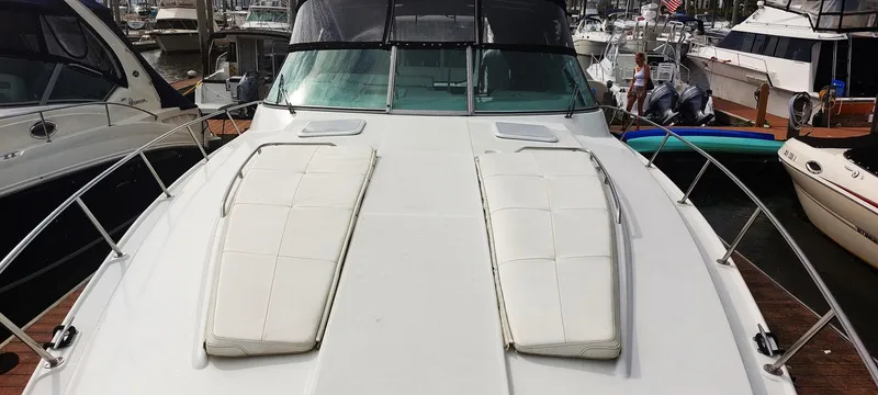 Slide: The Image of 1998 Formula 41 PC yacht docked at marina, featuring spacious deck and sleek design. - 31